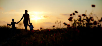 mother-children-family-sea-sunset-flowers-spring-silhouette-beautiful-women-her-seaside-67706252.jpg