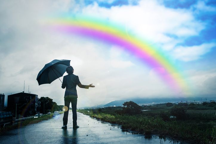 holding-umbrella-looking-at-rainbow.jpg