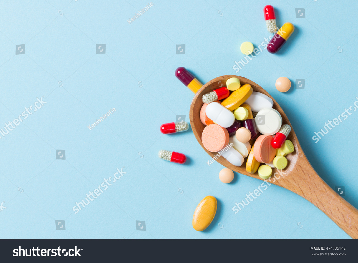 stock-photo-assorted-pharmaceutical-medicine-pills-tablets-and-capsules-on-wooden-spoon-474705142.jpg