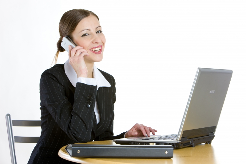 8345008-telephoning-businesswoman-with-a-laptop.jpg