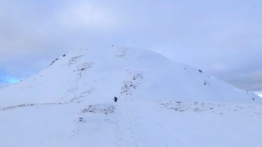 36 Nicky heading up to second false summit (Meall Odhar?).jpg