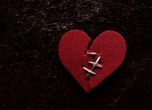 broken-hearted-red-heart-thread-stitches-grunge-background-87966158.jpg