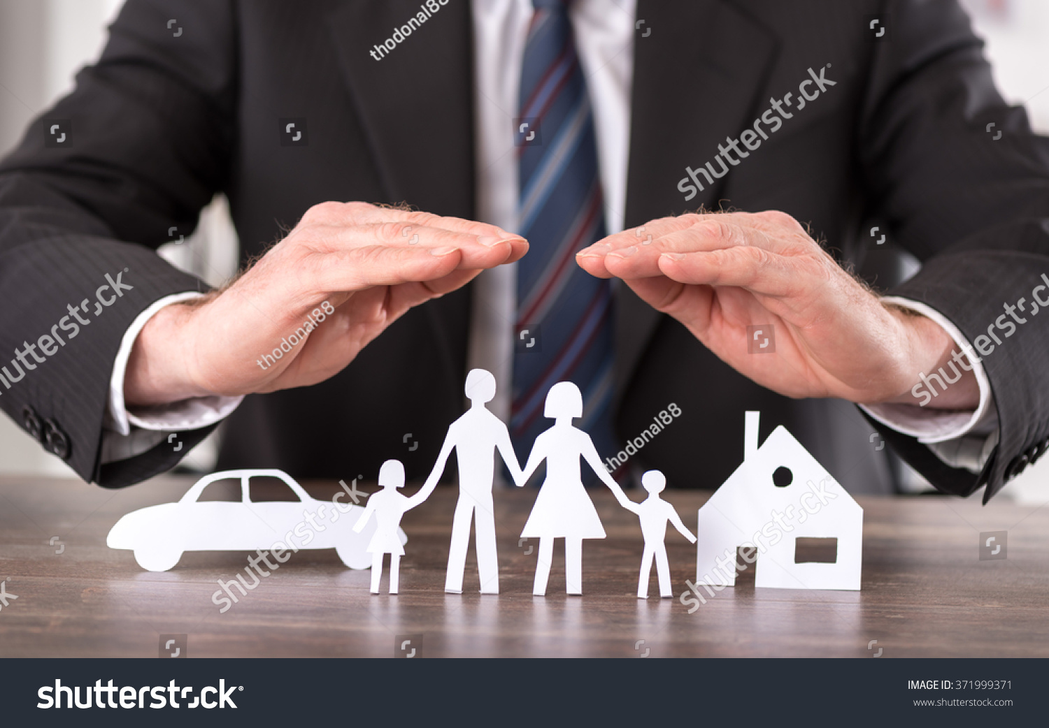 stock-photo-concept-of-insurance-with-hands-over-a-house-a-car-and-a-family-371999371.jpg