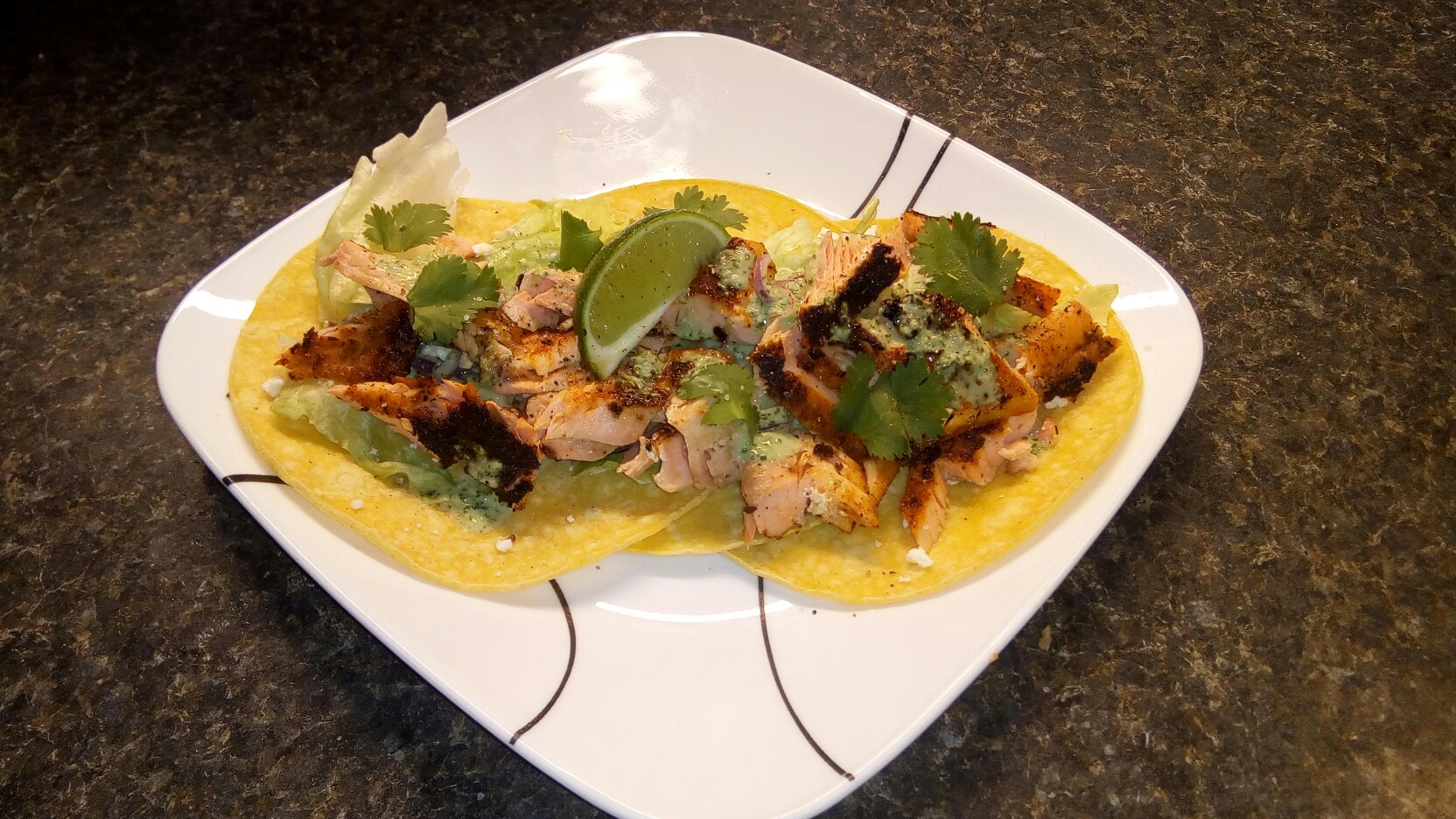 Blackened steel head trout soft tacos, with cilantro, jalapeno and lime sour cream sauce and red onion.jpg