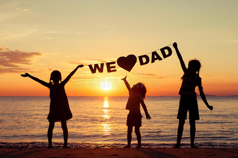 happy-children-playing-beach-sunset-time-hold-hands-inscription-love-dad-concept-father-49020891.jpg