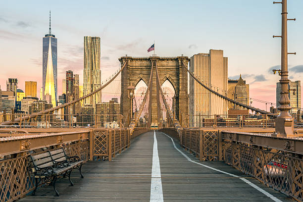 brooklyn-bridge-and-lower-manhattan-at-sunrise-new-york-city-picture-id496266816.jpg