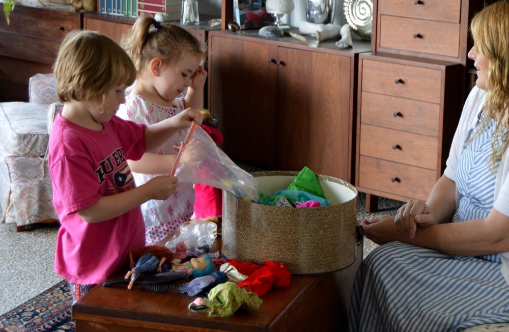 kids playing with barbie dolls