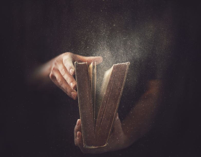 Hands-Opening-a-Dusty-Book.jpg