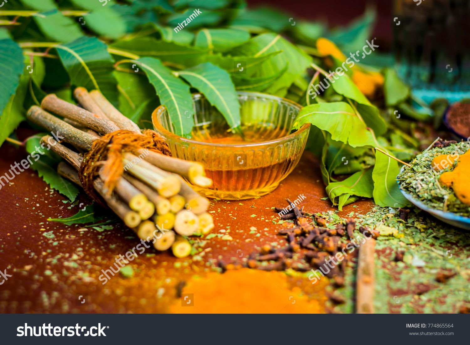 stock-photo-close-up-of-ingredients-of-ayurvedic-treatment-i-e-neem-neem-leaves-neem-powder-bark-clove-turmeric-774865564.jpg