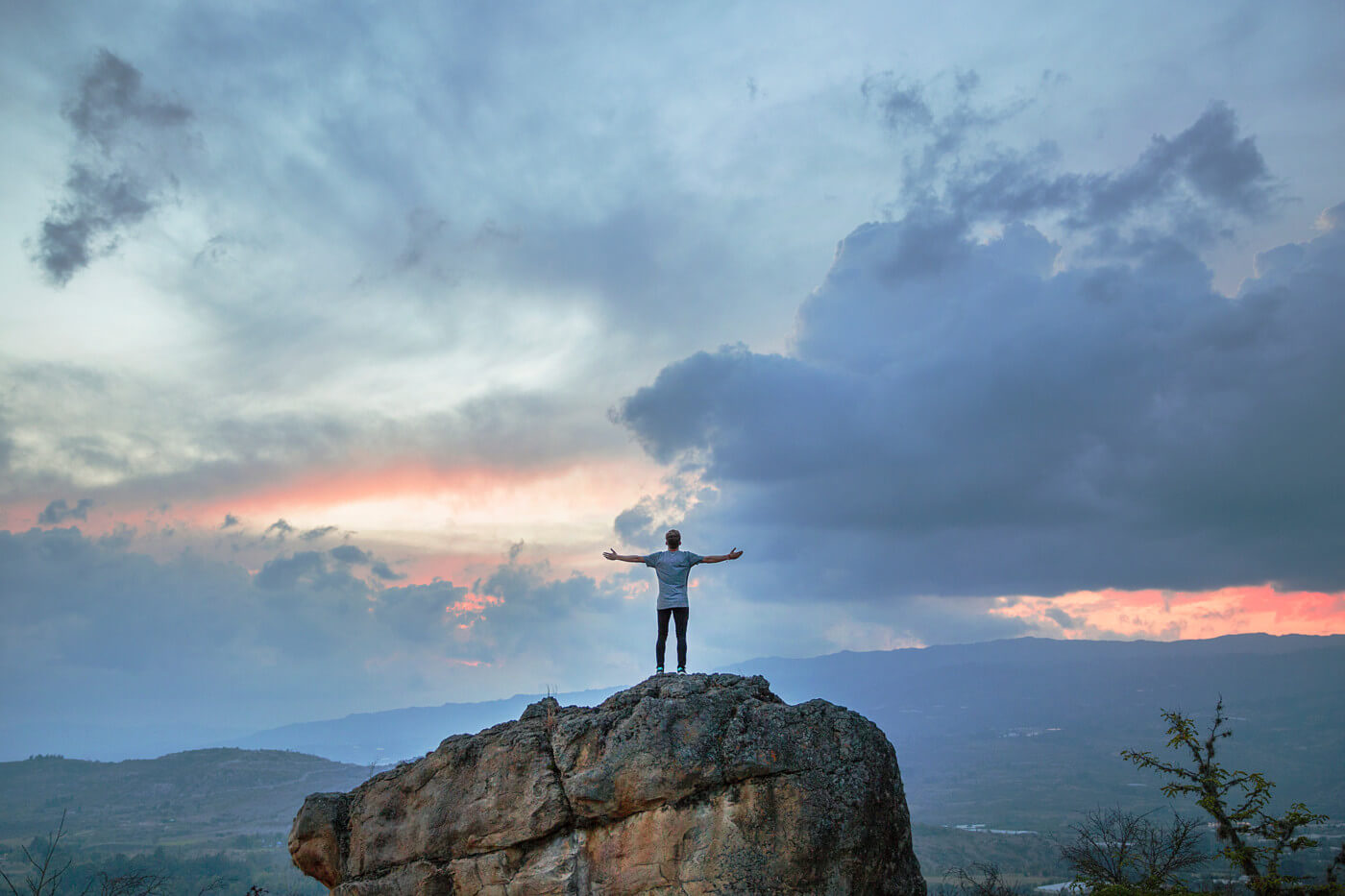 man-staning-on-rock-looking-for-meaning.jpg