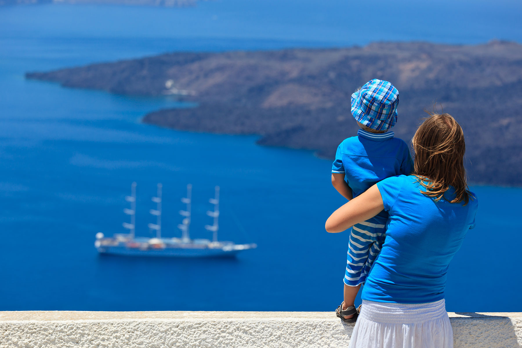 woman-holding-her-son-looking-at-the-sea.jpg