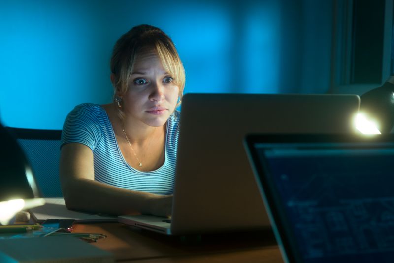 bigstock-Woman-Reading-Scary-Message-On-91409126.jpg