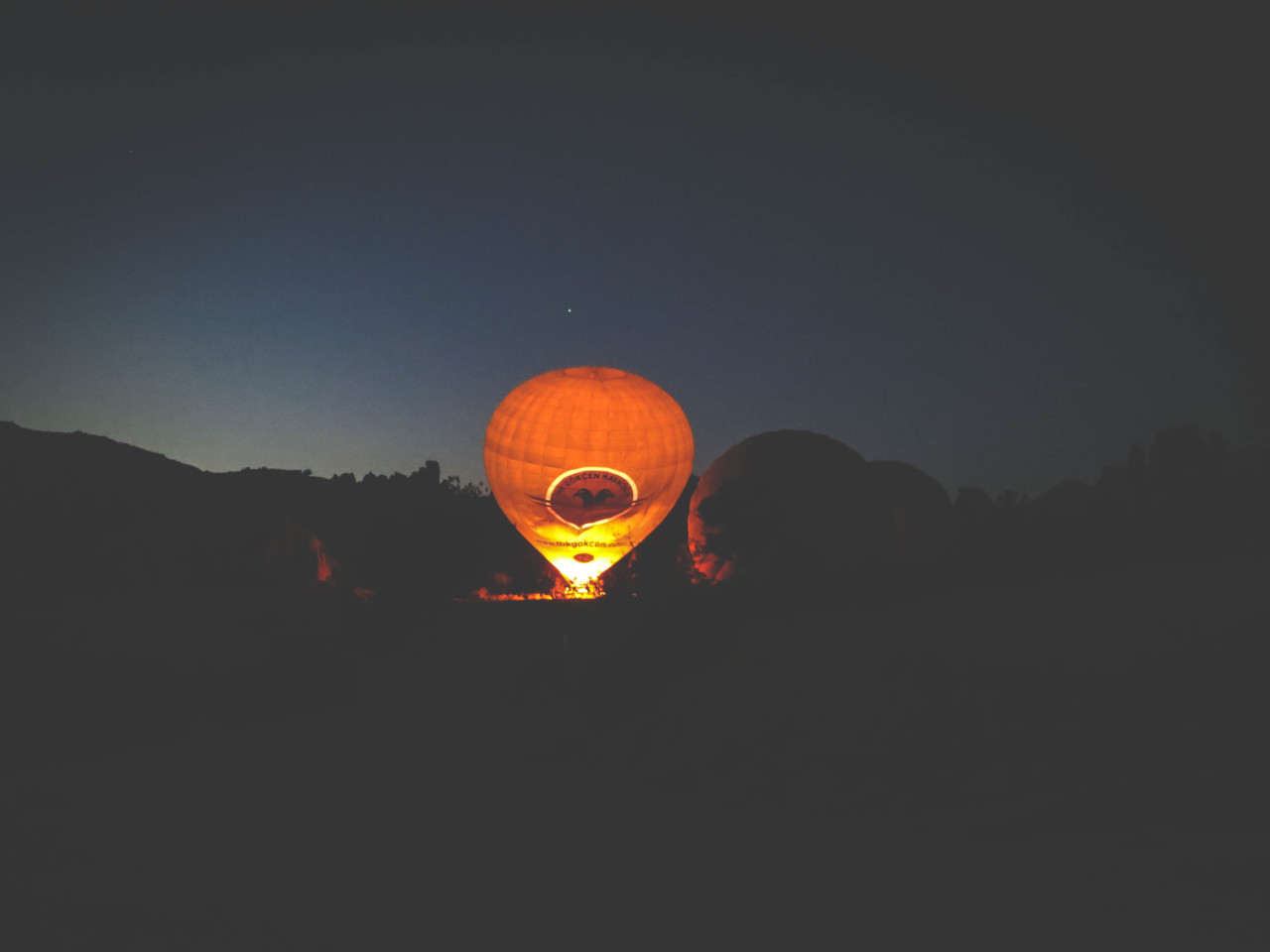 144.In the distance, another balloon gets filled up against the night sky..jpg