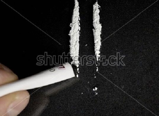 stock-photo-man-hands-rolls-banknote-for-using-cocaine-powder-lines-drug-addiction-concept-a-line-of-coke-on-1015792573.jpg