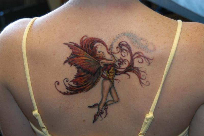 fairy-tattoo-on-upper-back.jpg