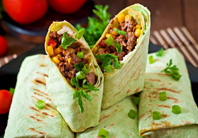 burritos-wraps-minced-beef-vegetables-wooden-background-54365886.jpg