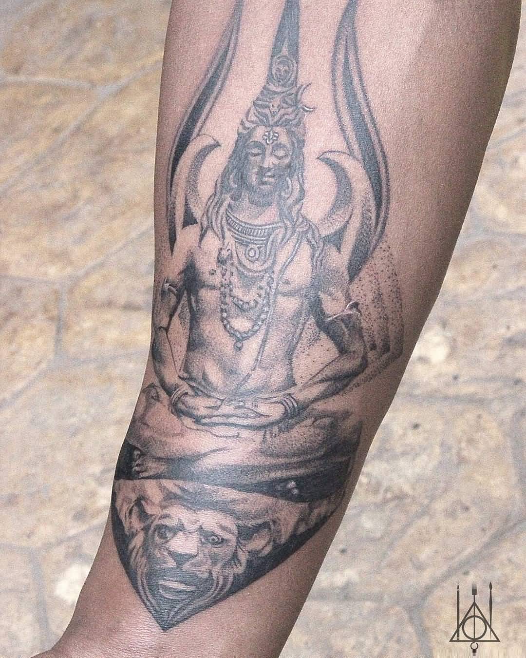 Grey-Ink-Dotted-Shiv-And-Trishul-Tattoo-On-Men-Arm.jpg