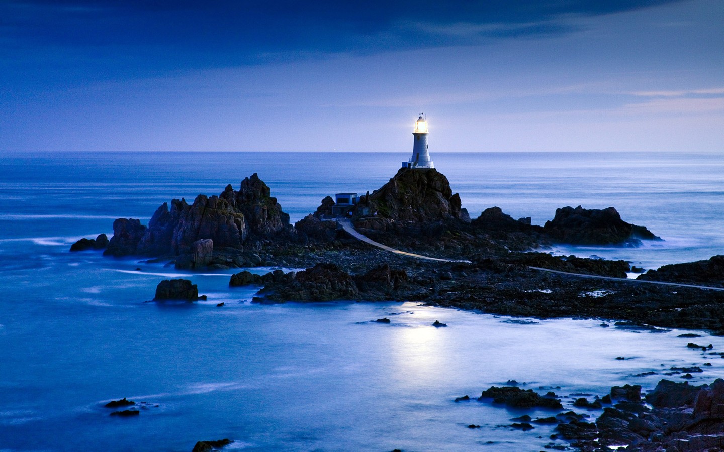 La-Corbiere-Lighthouse-Another photo that could easily be mistaken for a painting, pre-dawn blues color the landscape offering a peace and serenity that embodies the spirit of the lon.jpg