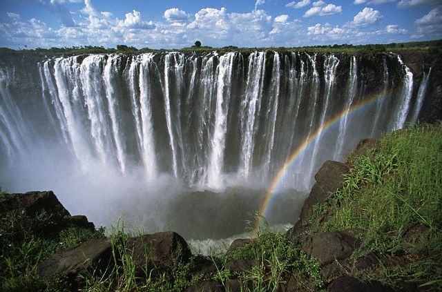 a-rainbow-forms-as-the-turbulent-waters-of-zambezi-river-rush-over-victoria-falls.jpg