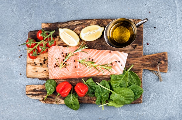 salmon-and-vegetables-on-rustic-chopping-board.jpg