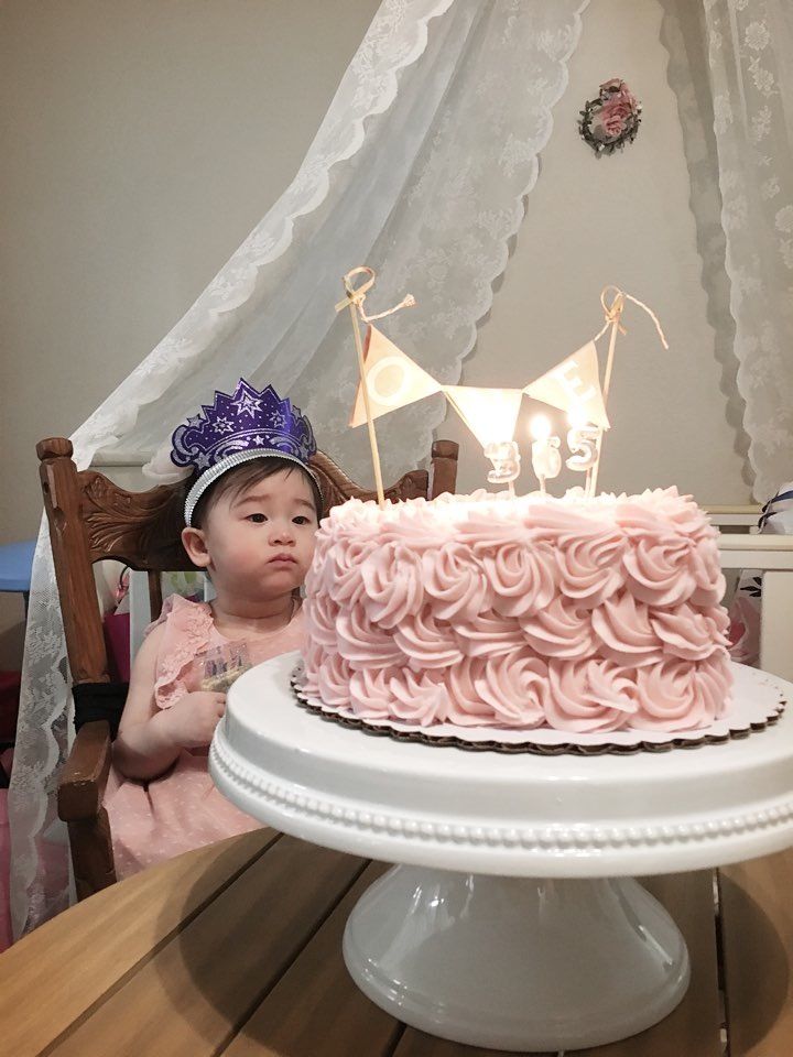 Charlotte and her first birthday cake.jpg