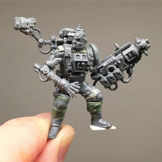 scratchbuilt conversion with genestealer cultist knees and catachan arms.jpg