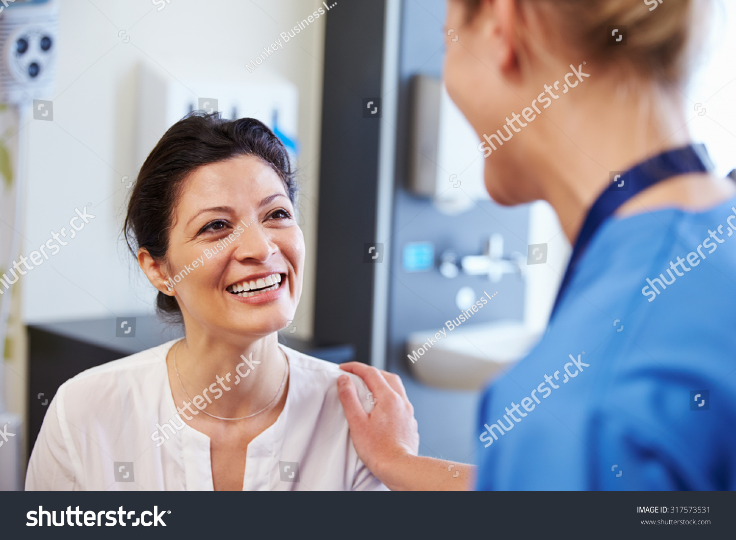 stock-photo-female-patient-being-reassured-by-doctor-in-hospital-room-31757.jpg