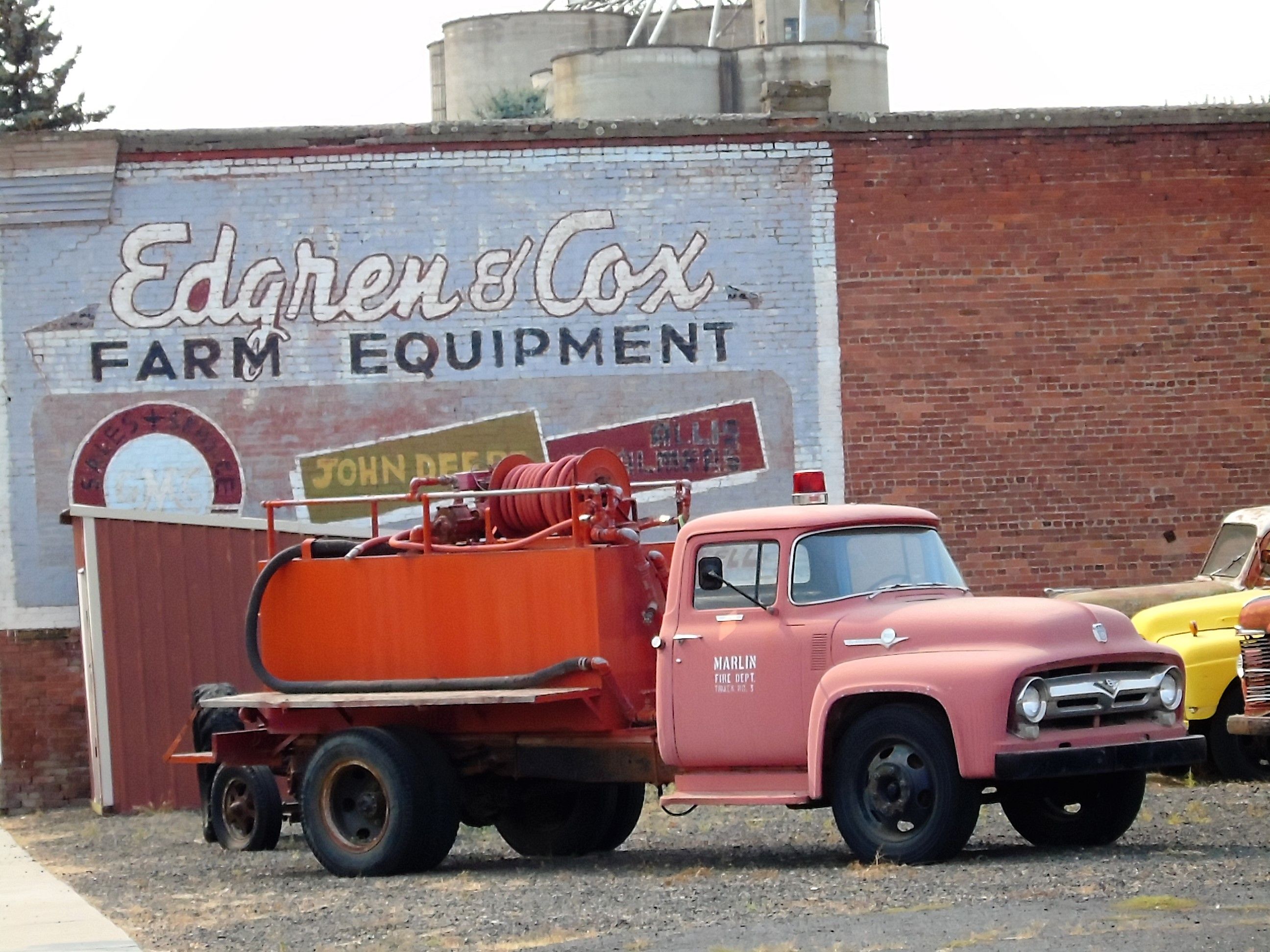 Dave's Old Truck Rescue with Building advertisement in background.jpg