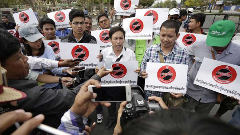 union_members_speak_to_the_press_at_a_protest_against_the_trade_union_law_in_phnom_penh_last_year._hong_menea.jpg