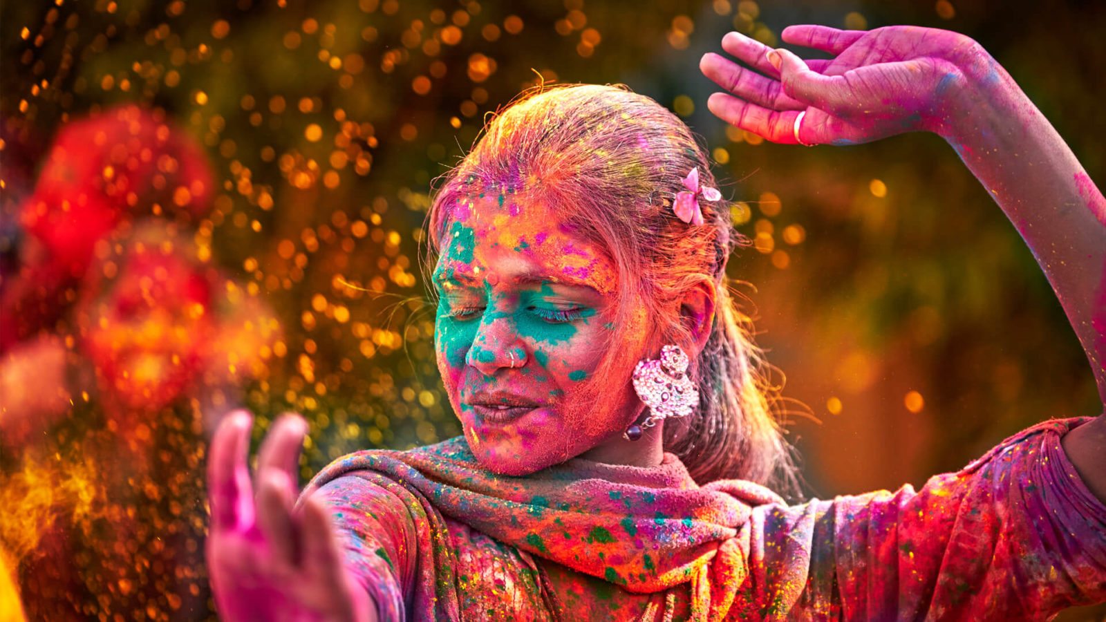 indian-woman-dancing-in-holi-festival-in-india-1600x900.jpg