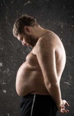 over-weight-man-looking-down-at-his-belly.jpg