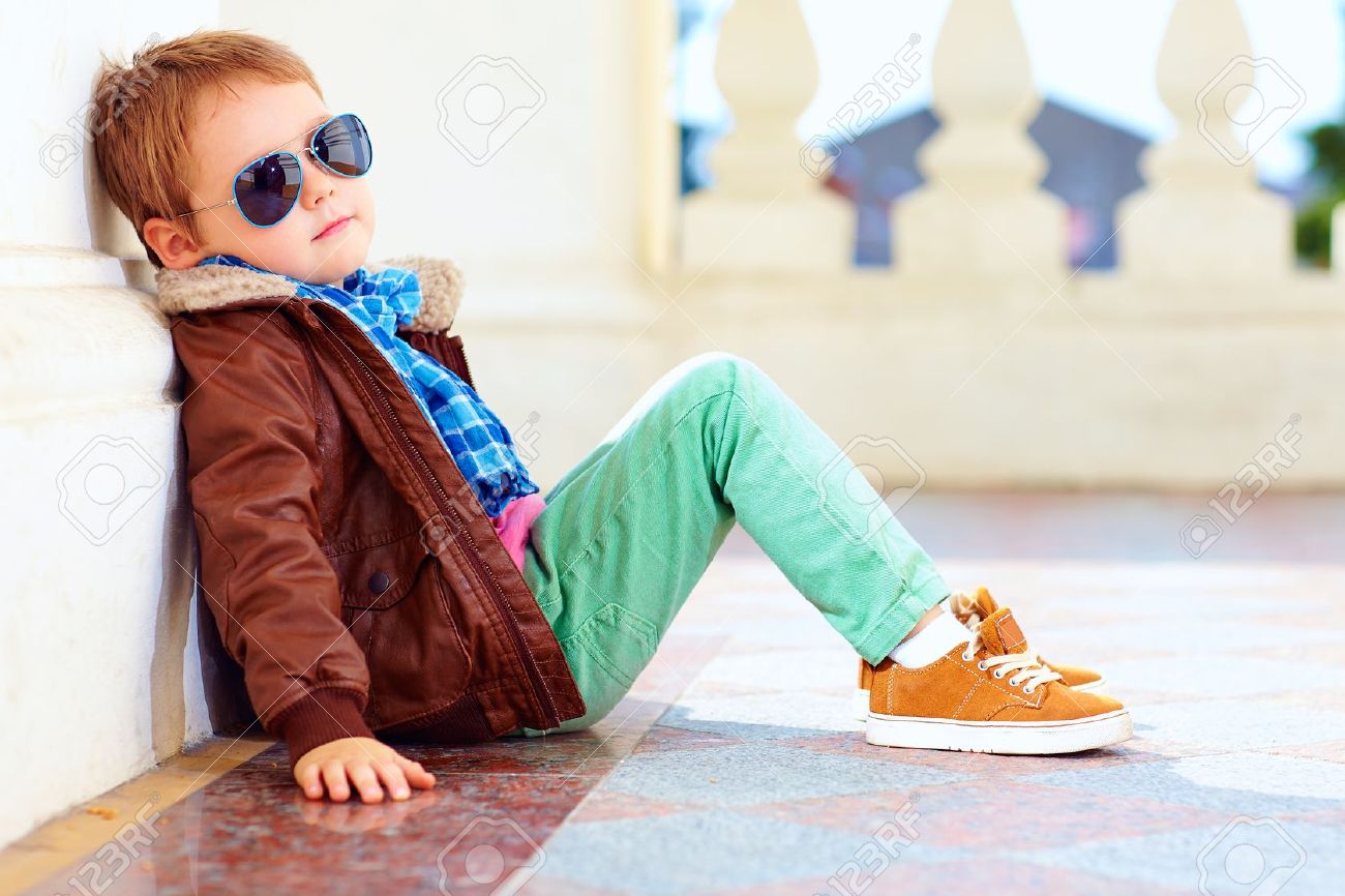 30733445-cute-stylish-boy-in-leather-jacket-and-gum-shoes-Stock-Photo.jpg