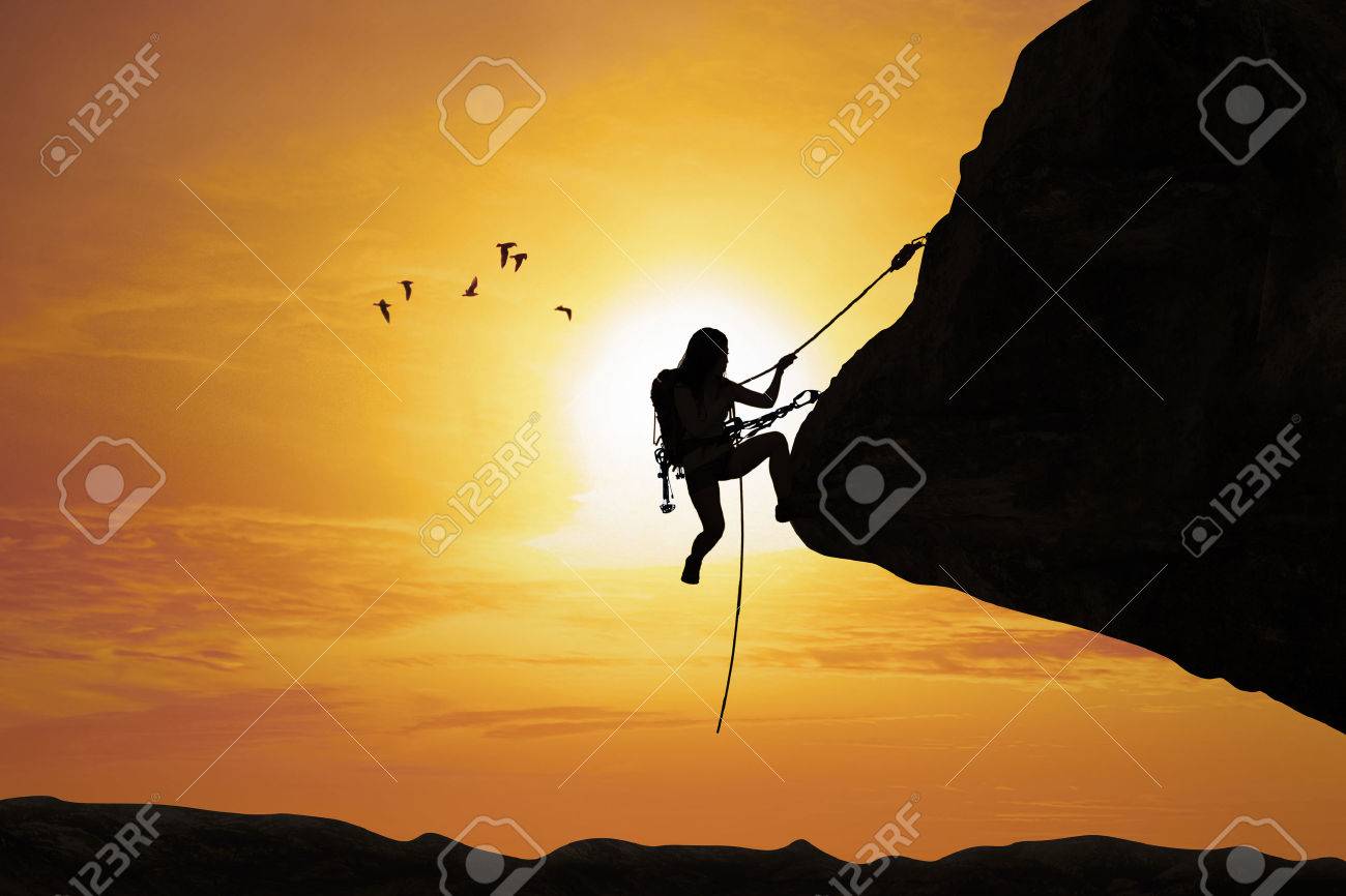 39887356-silhouette-of-young-women-try-to-climb-the-mountain-at-sunset-time-Stock-Photo.jpg