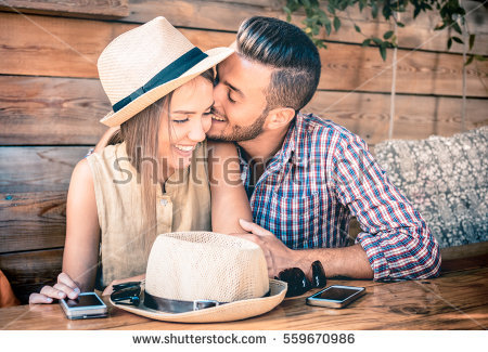 stock-photo-young-fashion-couple-of-lovers-at-beginning-of-love-story-handsome-man-whispers-sexy-kisses-in-559670986.jpg
