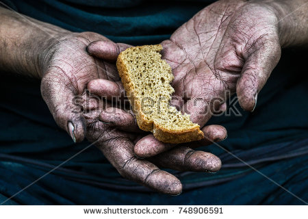 stock-photo-dirty-hands-homeless-poor-man-with-piece-of-bread-in-modern-capitalism-society-748906591.jpg