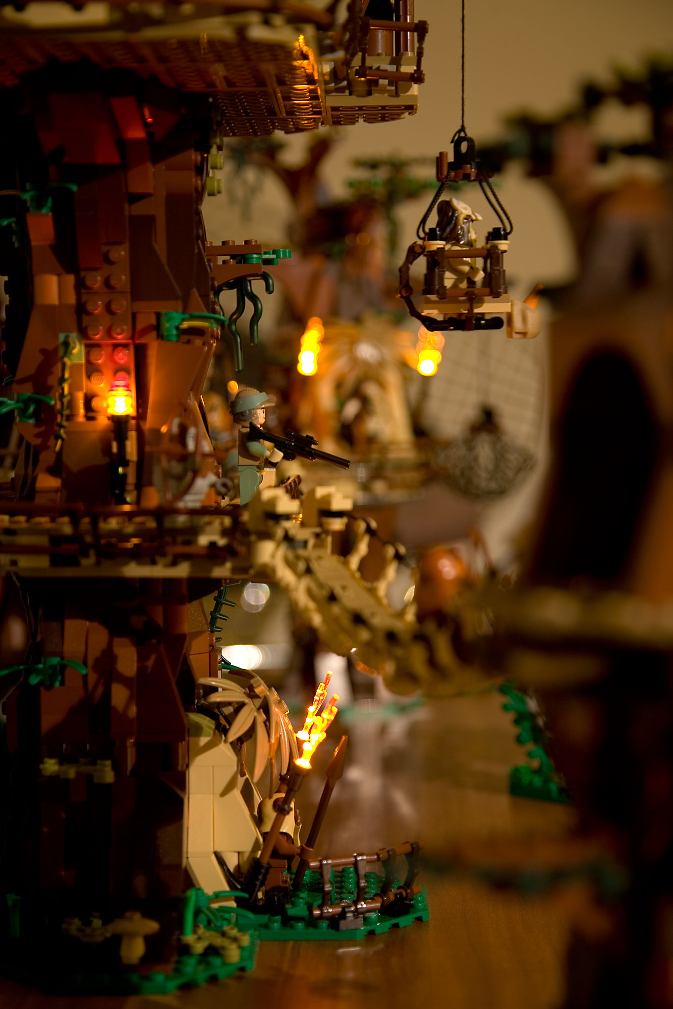 LEGO modded 10236 Ewok Village with LED lit flames and fires - torch wiring visible at the bottom