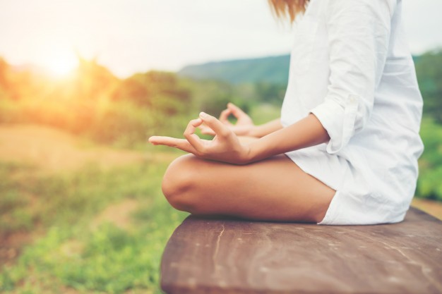 woman-hands-yoga-meditations-and-making-a-zen-symbol-with-her-ha_1150-794.jpg