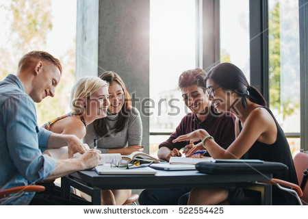 stock-photo-happy-young-university-students-studying-with-books-in-library-group-of-multiracial-people-in-522554425.jpg