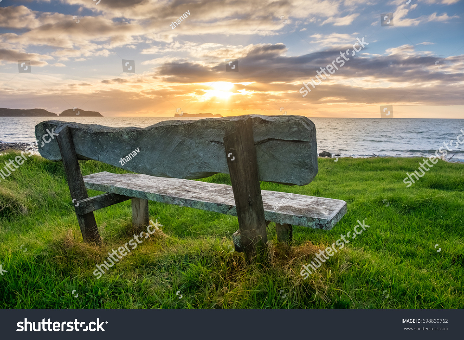 stock-photo-bench-overlooking-the-ocean-698839762.jpg