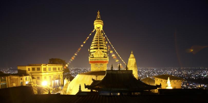 181093-kathmandu-valley-is-seen-against-the-illuminated-swyambhu-nath-stupa-d.jpg