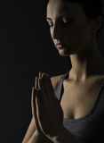 praying-woman-prayer-close-up-portrait-black-bac-over-background-43116430.jpg