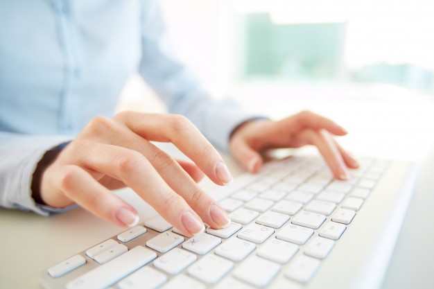 close-up-of-employee-with-computer-keyboard_1098-2019.jpg