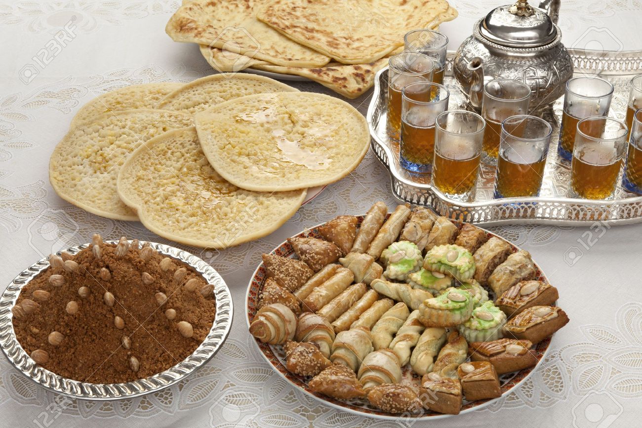 20996135-Traditional-Moroccan-tea-cookies-almond-sellou-and-pancakes-at-id-al-fitr-the-end-of-Ramadan-Stock-Photo.jpg