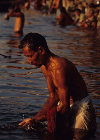 India - Varanasi - Bathing and Ritual Praying in the Ganges.jpg