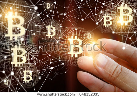 stock-photo-hand-of-a-businessman-with-bitcoin-in-the-network-648152335.jpg