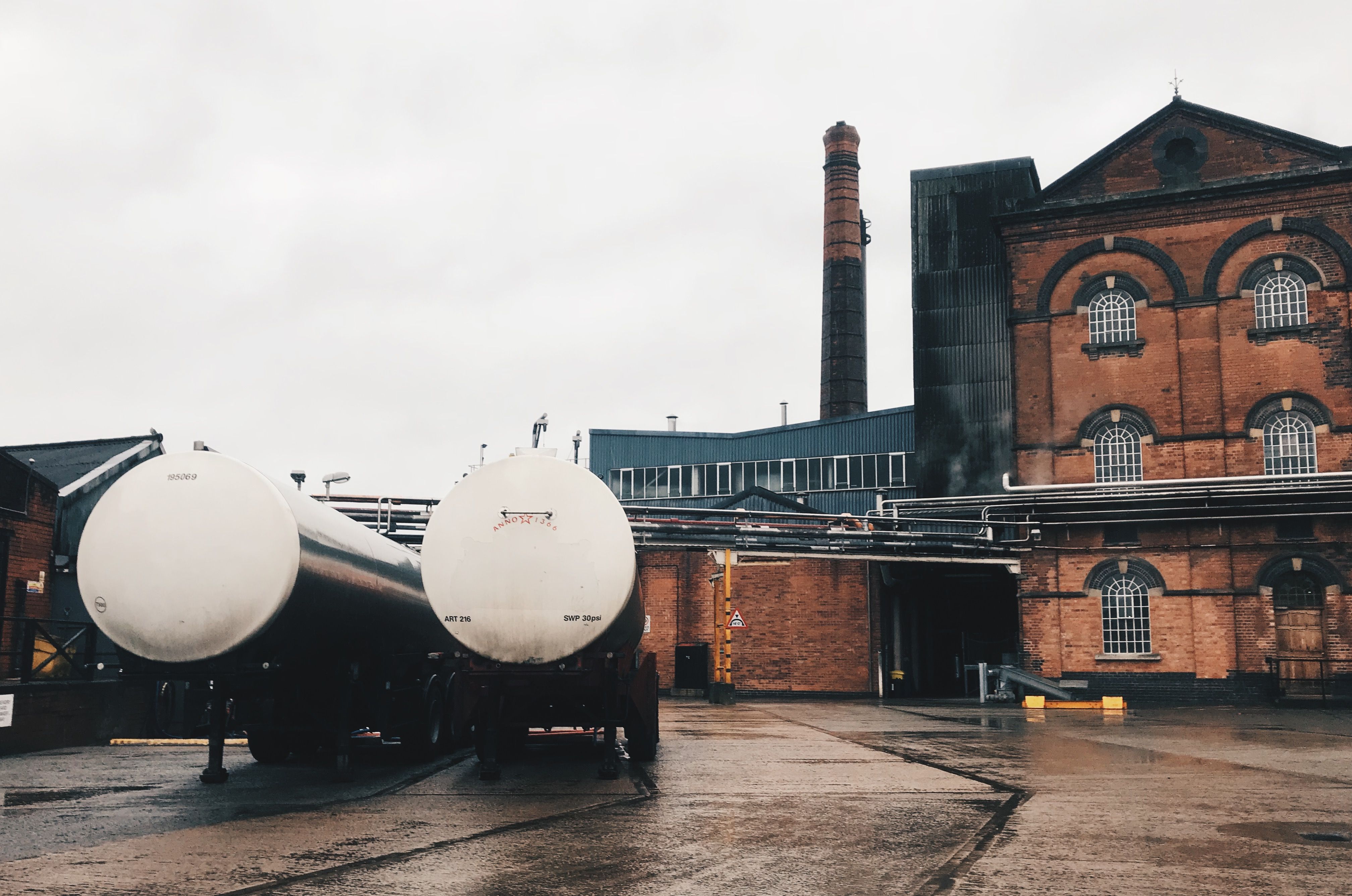 two-trucks-and-building