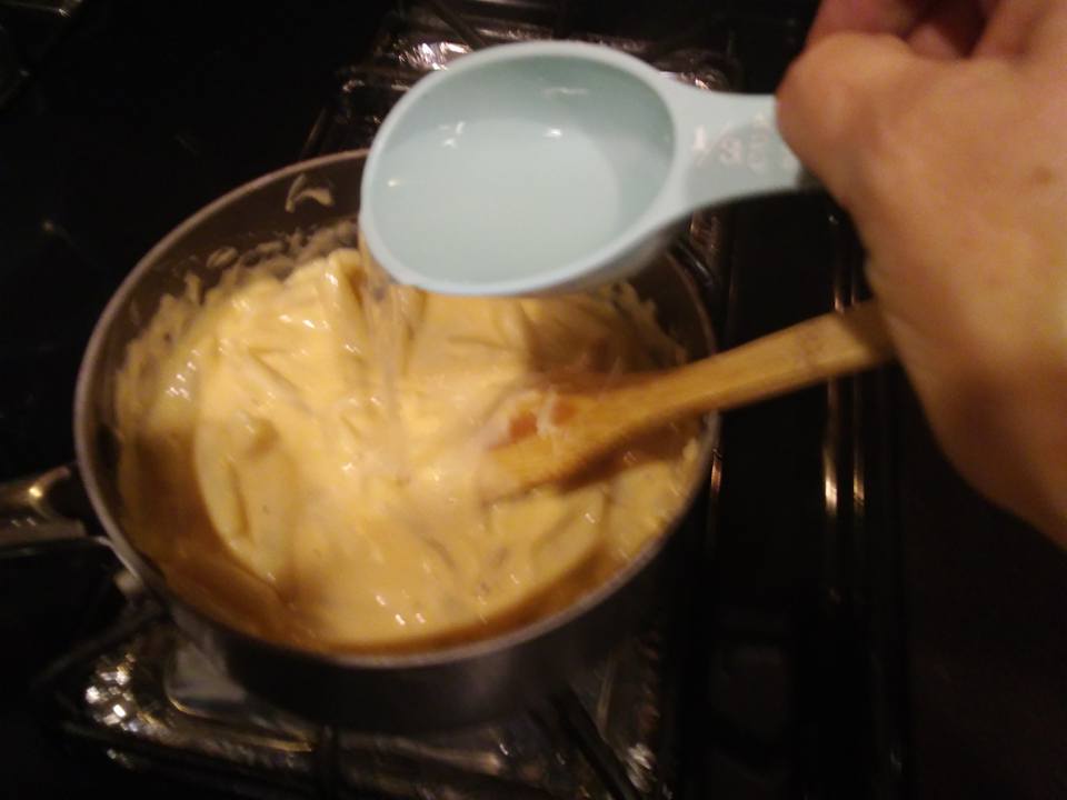 mac and cheese 18 stir in mac add pasta water.jpg