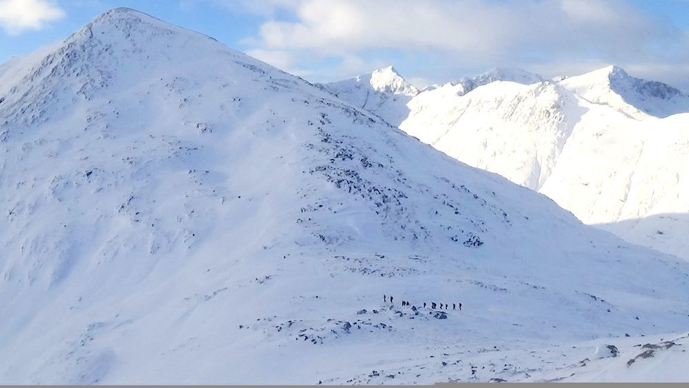 28 Group trekking over Mam Buidhe (bealach) fuller shot.jpg