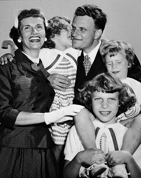 american-evangelist-billy-graham-embraces-his-family-upon-his-return-picture-id51809892.jpg