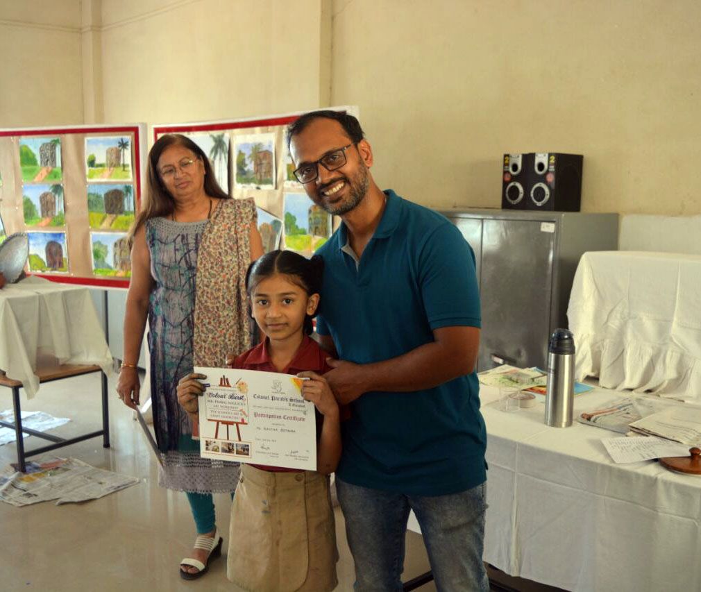 Giving Certificate of Participation as Mrs Parab looks on